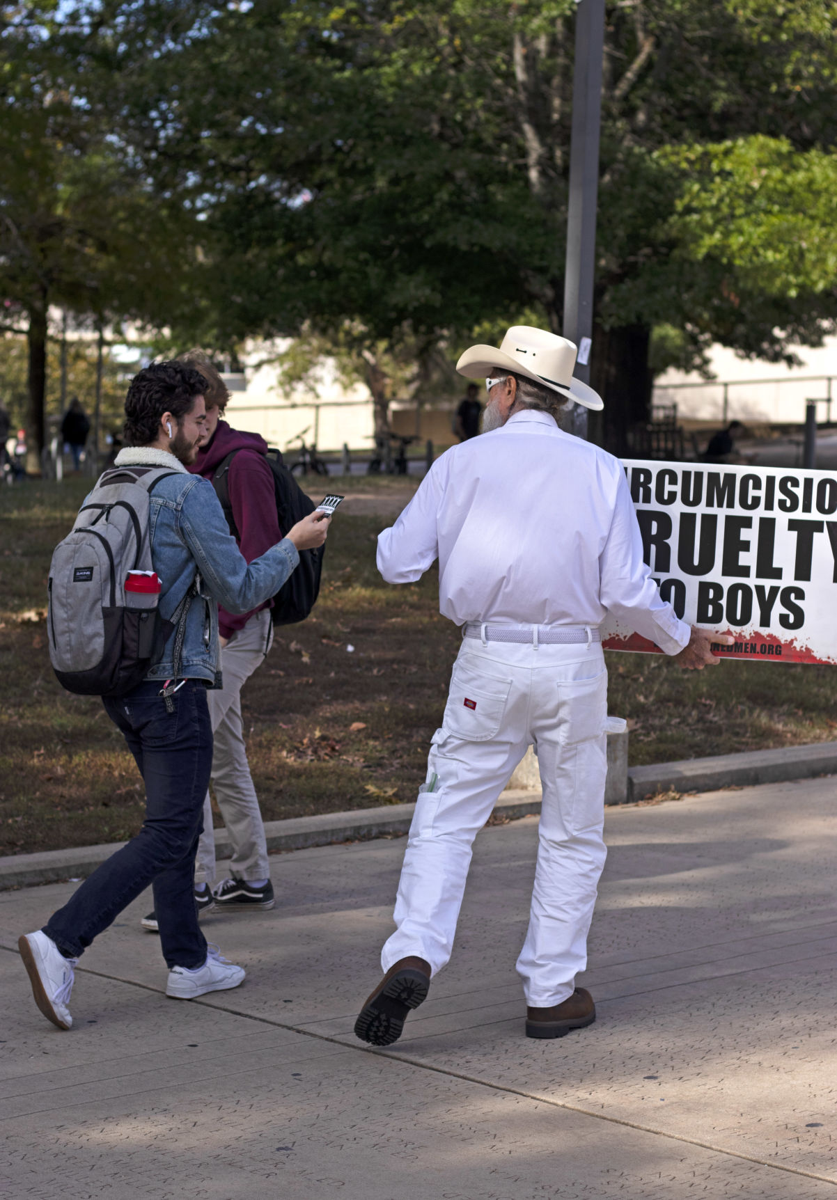 Protestors Seek to Tell Students About Circumcision Platform